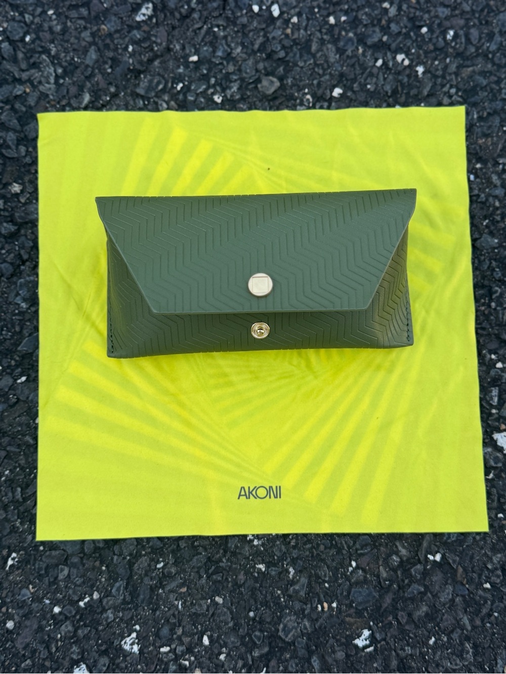 Akoni Olive Green sunglass case with glass cleaner cloth